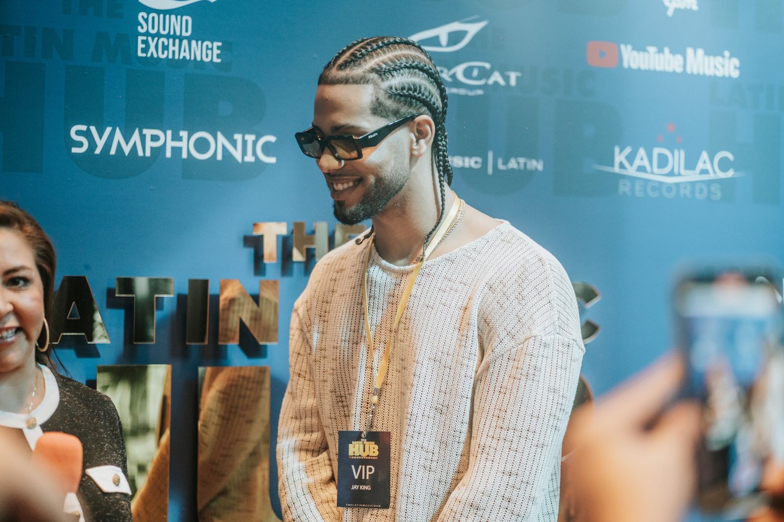 A VIP guest at the sponsor wall of The Latin Music Hub Conference